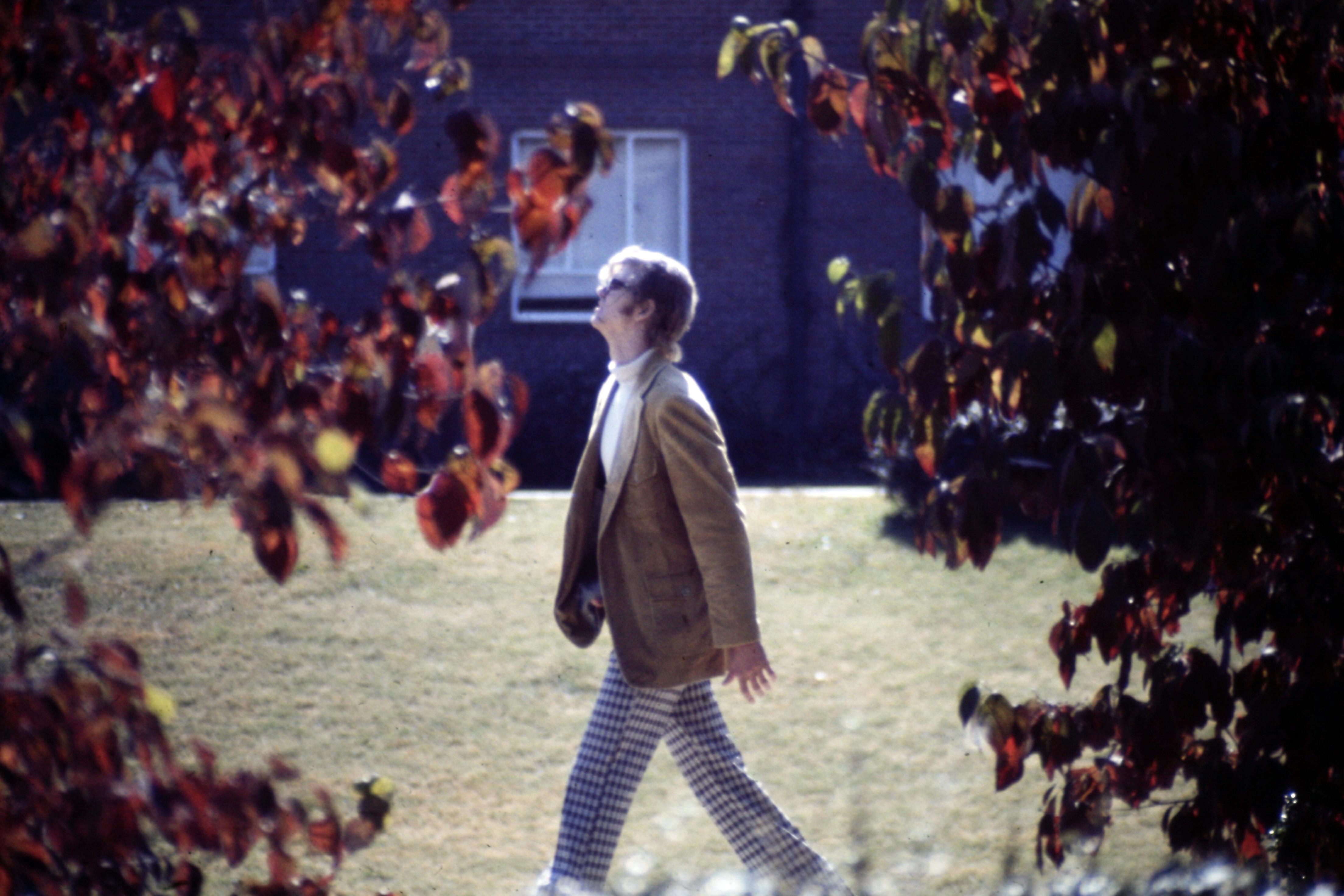 hippy looking guy walking 